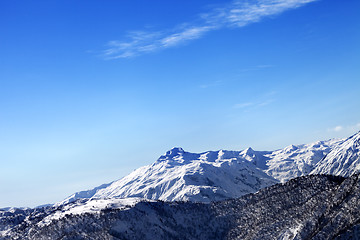 Image showing Snowy mountains and blue sky in early sunny morning