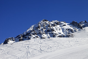 Image showing Ski slope and snow rocks