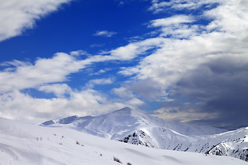 Image showing Ski slope and beautiful sky with clouds in evening