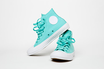 Image showing Turquoise sneakers on blank white background