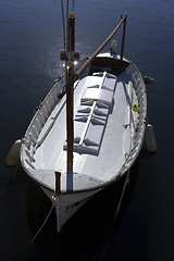 Image showing Single wooden white fishing boat
