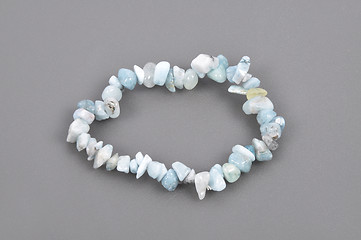 Image showing Splintered aquamarine chain on gray background