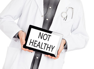 Image showing Doctor holding tablet - Not healthy