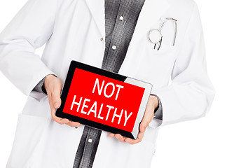 Image showing Doctor holding tablet - Not healthy