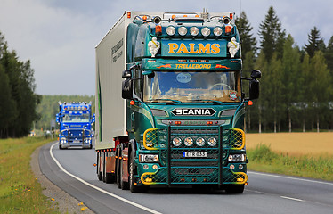 Image showing Green Customized Scania V8 Palms in Truck Convoy