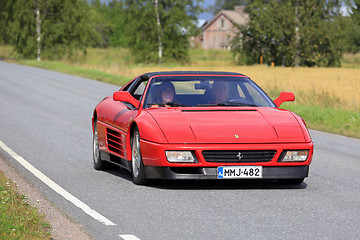 Image showing Red Ferrari 348 Cruising Along Country Road