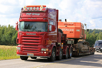 Image showing Red Scania Semi Transports Construction Machinery Uphill