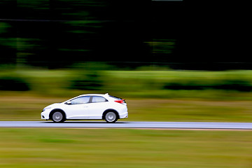 Image showing Fast White Car on Freeway