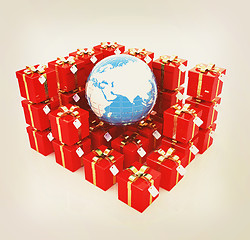 Image showing Traditional Christmas gifts and earth. Global holiday concept. 3