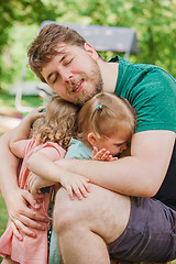 Image showing Happy family and father\'s day. child daughters hugging dad