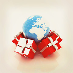 Image showing Traditional Christmas gifts and earth. Global holiday concept . 