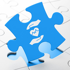 Image showing Insurance concept: Heart And Palm on puzzle background