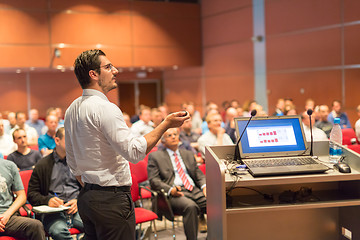 Image showing Public speaker giving talk at Business Event.