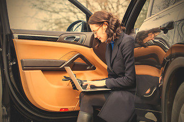 Image showing business woman with a notebook on her lap