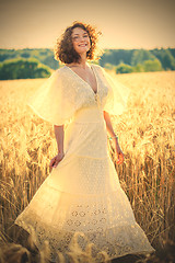 Image showing Beautiful smiling woman dancing on the summer Field