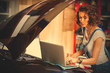 Image showing mechanic diagnoses the car engine works