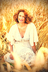 Image showing middle aged pretty smiling woman outdoors