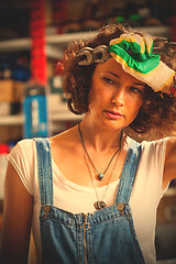 Image showing portrait of a auto mechanic woman wiping the face