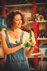 Image showing woman mechanic wearing protective gloves