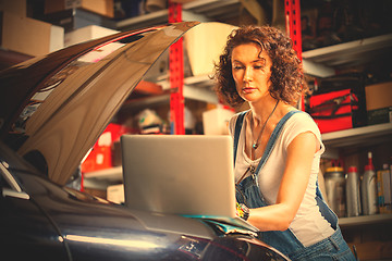 Image showing mechanic diagnoses the car engine works