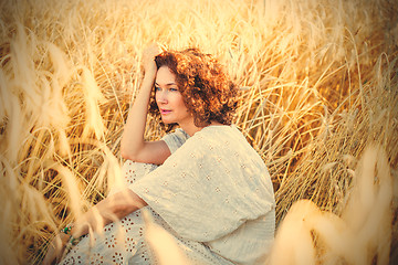 Image showing middle aged beautiful smiling woman in wheat field