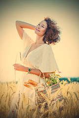 Image showing beautiful smiling woman outdoors in barley field