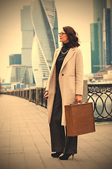 Image showing woman holding old wooden case