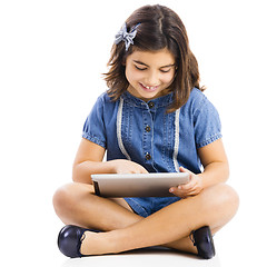 Image showing Young girl using a tablet