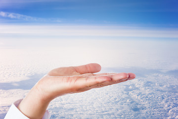 Image showing Open Palm Of Hand High Above The Clouds