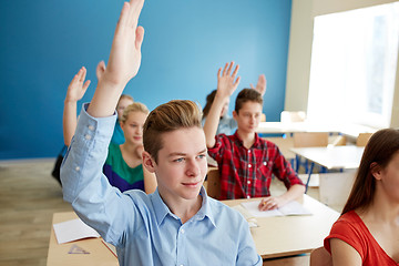 Image showing group of students raising hands at school lesson