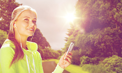 Image showing sporty woman with smartphone listening to music