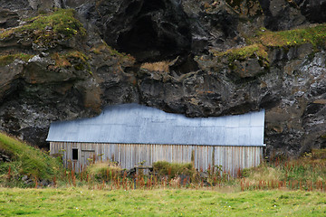 Image showing House under the cliff
