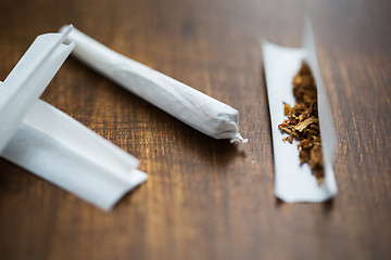 Image showing close up of marijuana joint and tobacco