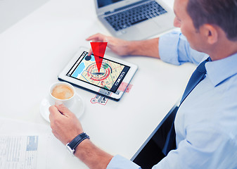 Image showing businessman with tablet pc and coffee in office