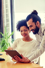 Image showing happy creative team with tablet pc in office