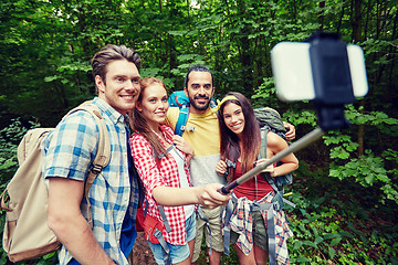 Image showing friends with backpack taking selfie by smartphone