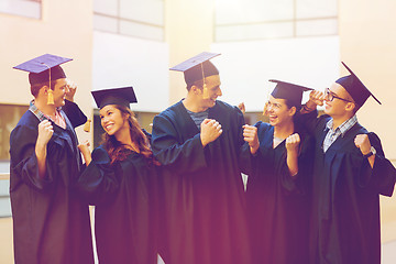 Image showing group of smiling students in mortarboards