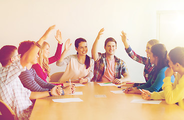 Image showing group of smiling students voting