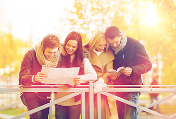 Image showing couples with tourist map in autumn park