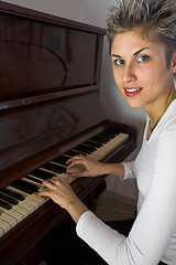 Image showing woman and piano