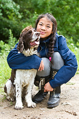 Image showing Girl with a dog