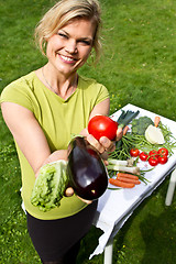 Image showing Cute blond girl with vegetables