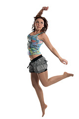 Image showing Successful young attractive laughing woman jumping up