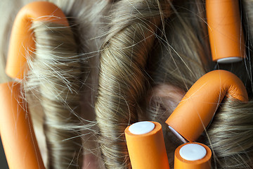 Image showing curlers in her hair