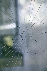 Image showing Broken glass on the window