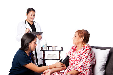 Image showing Nurse measuring blood pressure