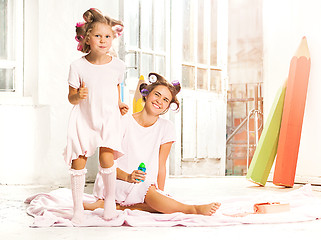 Image showing Little girl playing with her mother