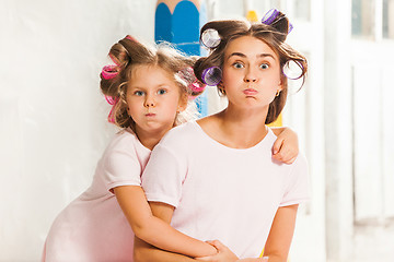 Image showing Little girl playing with her mother