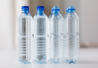 Image showing close up of bottles with drinking water on table