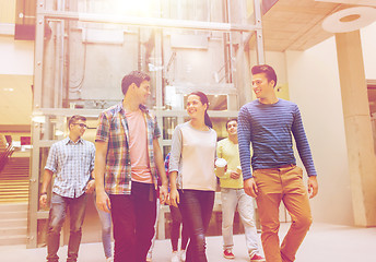 Image showing group of smiling students with paper coffee cups